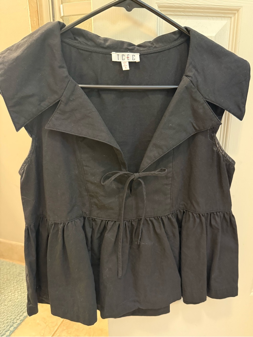 TCEC Black Sleeveless Peplum Tie-Front Top with Wide Collar
